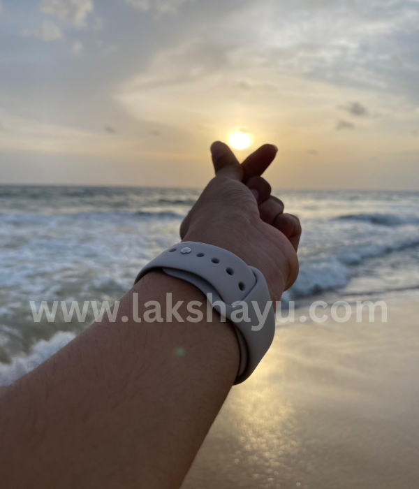 Showing heart to the sun and the beach